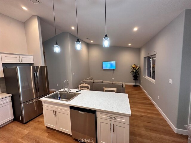 kitchen with white cabinets, sink, and appliances with stainless steel finishes