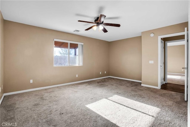 unfurnished room with carpet and ceiling fan