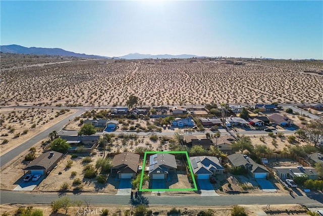 drone / aerial view featuring a mountain view