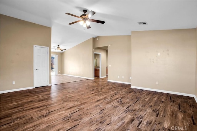 spare room featuring hardwood / wood-style floors, vaulted ceiling, and ceiling fan