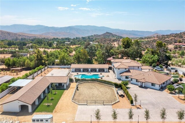 birds eye view of property featuring a mountain view