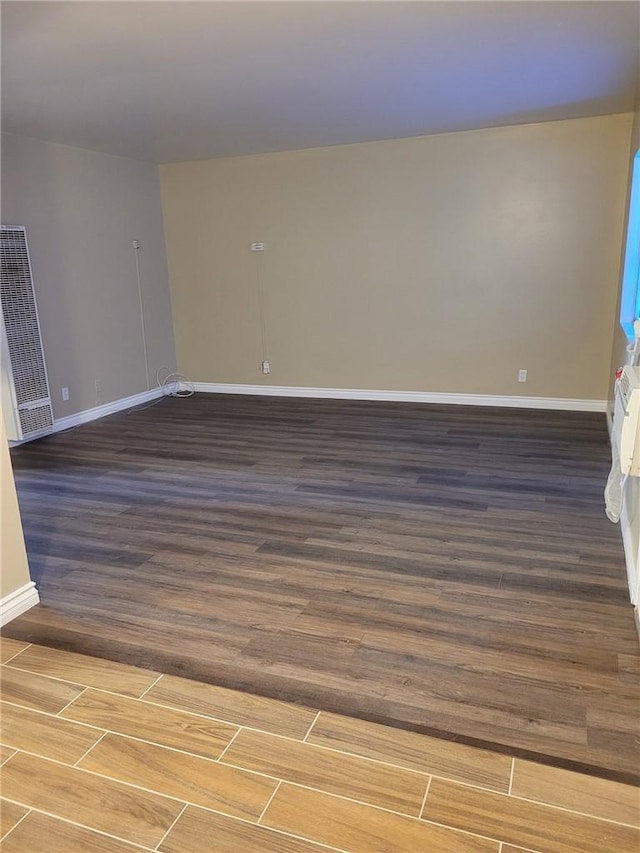 empty room featuring dark hardwood / wood-style floors