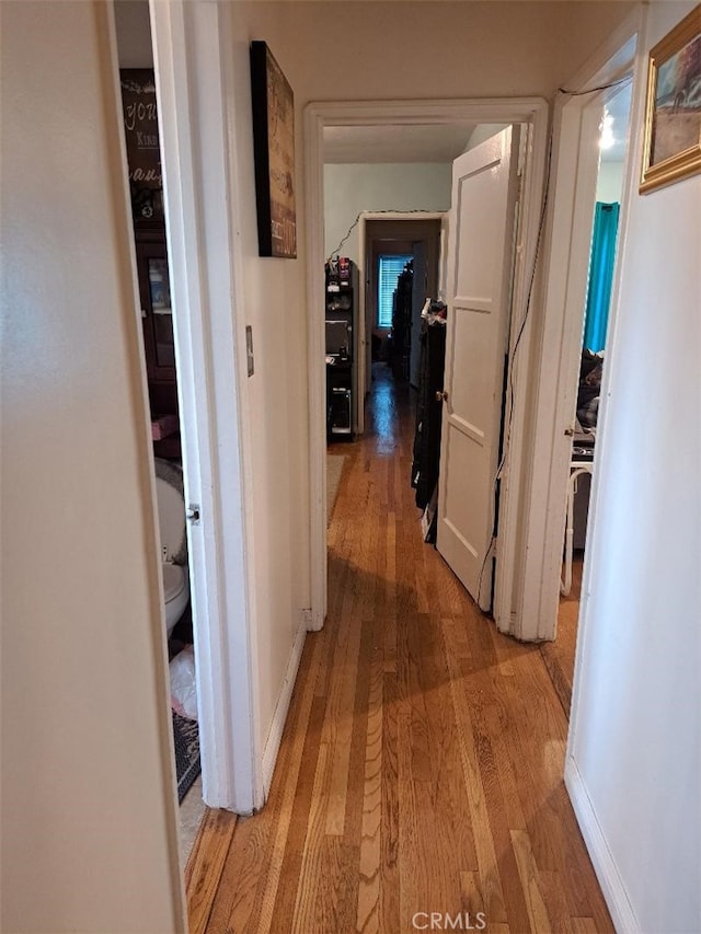 corridor featuring light hardwood / wood-style flooring