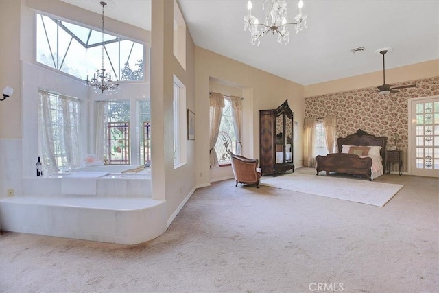 bathroom featuring a wealth of natural light, a chandelier, and a towering ceiling