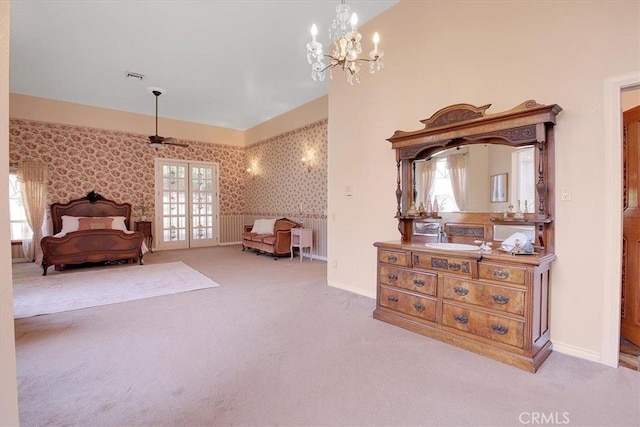 bedroom featuring multiple windows and light colored carpet