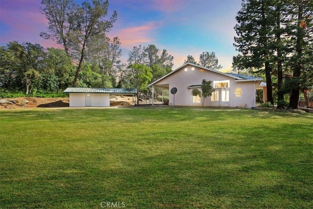 view of front of home with a yard