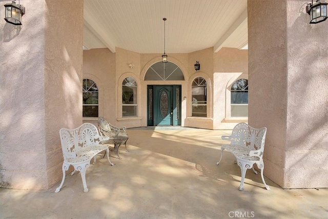 property entrance with a patio area