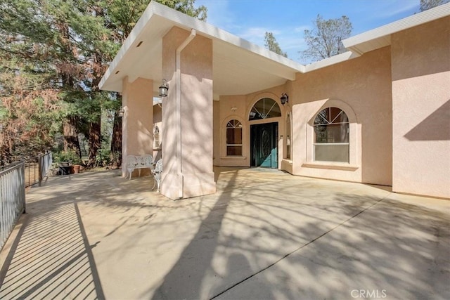 doorway to property featuring a patio area