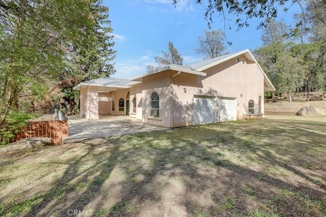 rear view of property featuring a lawn and a patio