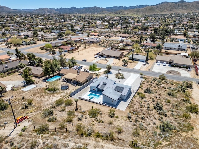 birds eye view of property featuring a mountain view