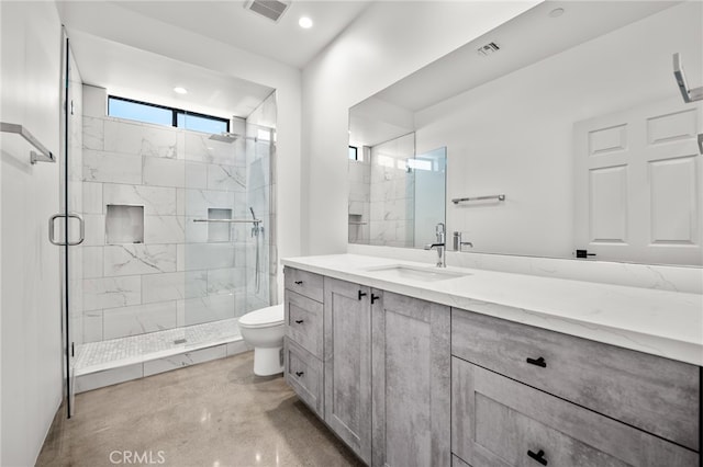 bathroom with toilet, concrete floors, vanity, and a shower with door