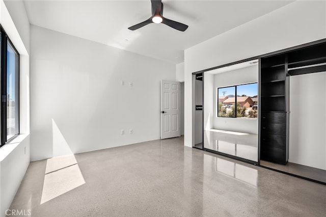 unfurnished bedroom with a closet and ceiling fan