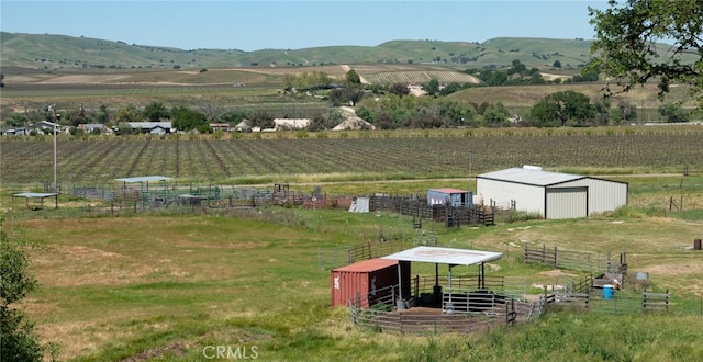 aerial view featuring a rural view and a mountain view