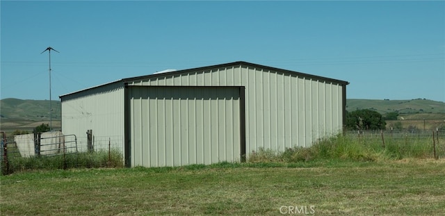 view of outbuilding with a mountain view