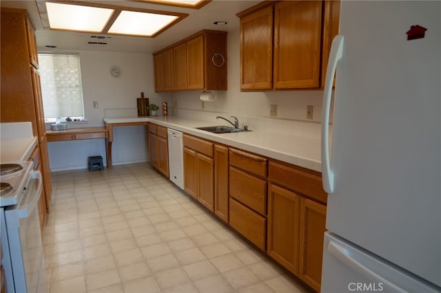 kitchen with white appliances and sink