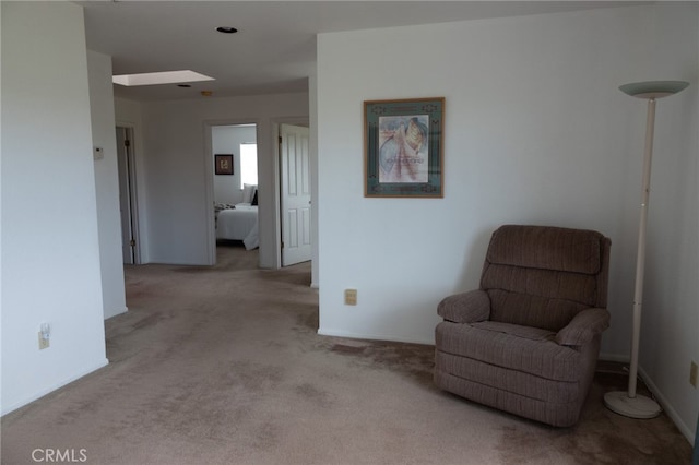 living area with light colored carpet