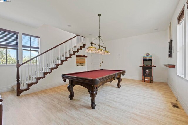 playroom with light wood-type flooring and pool table