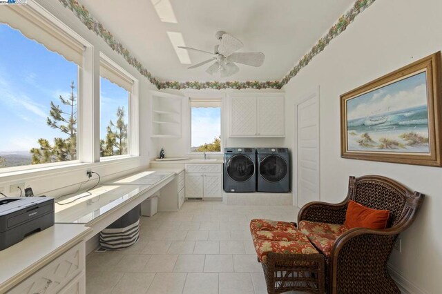 laundry room with washer and clothes dryer, cabinets, sink, ceiling fan, and light tile patterned flooring