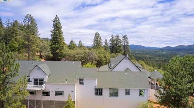 birds eye view of property with a mountain view