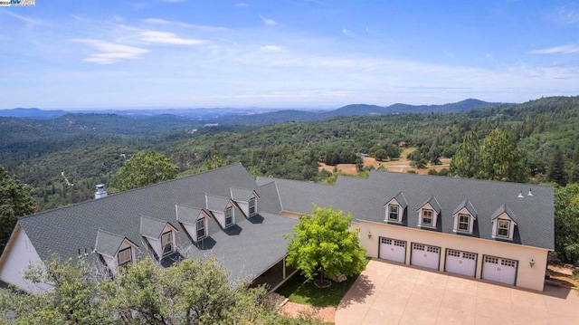 drone / aerial view featuring a mountain view