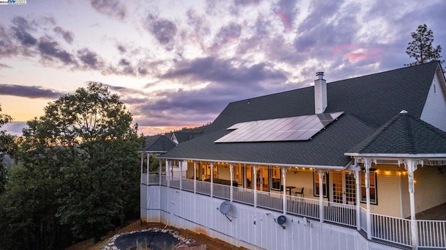 back house at dusk with solar panels