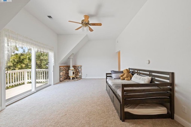 carpeted bedroom with ceiling fan, access to outside, and vaulted ceiling