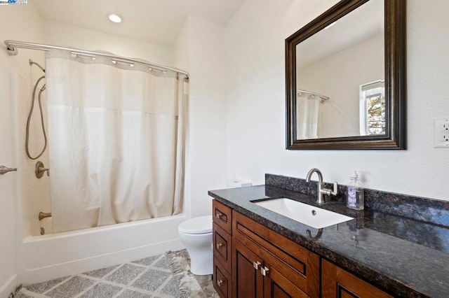 full bathroom featuring shower / bath combo, toilet, and vanity