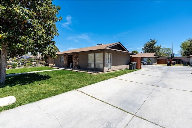 ranch-style house with a front lawn