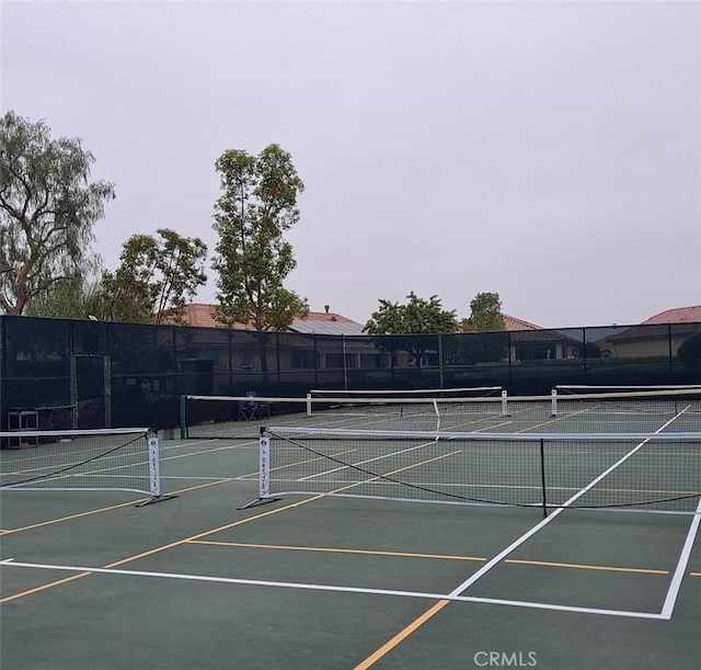 view of sport court with fence