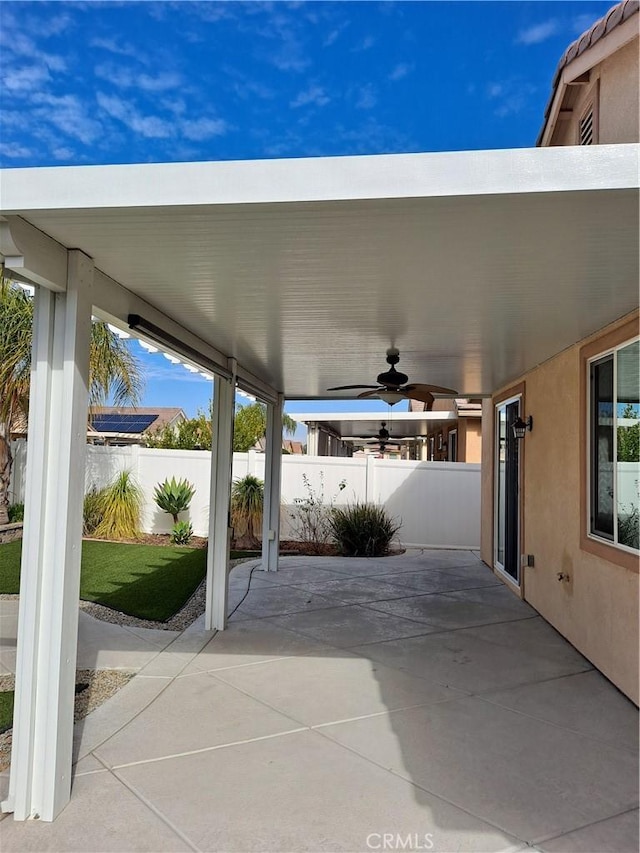 view of patio featuring ceiling fan and a fenced backyard