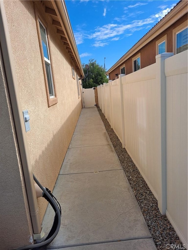 view of home's exterior featuring fence and stucco siding