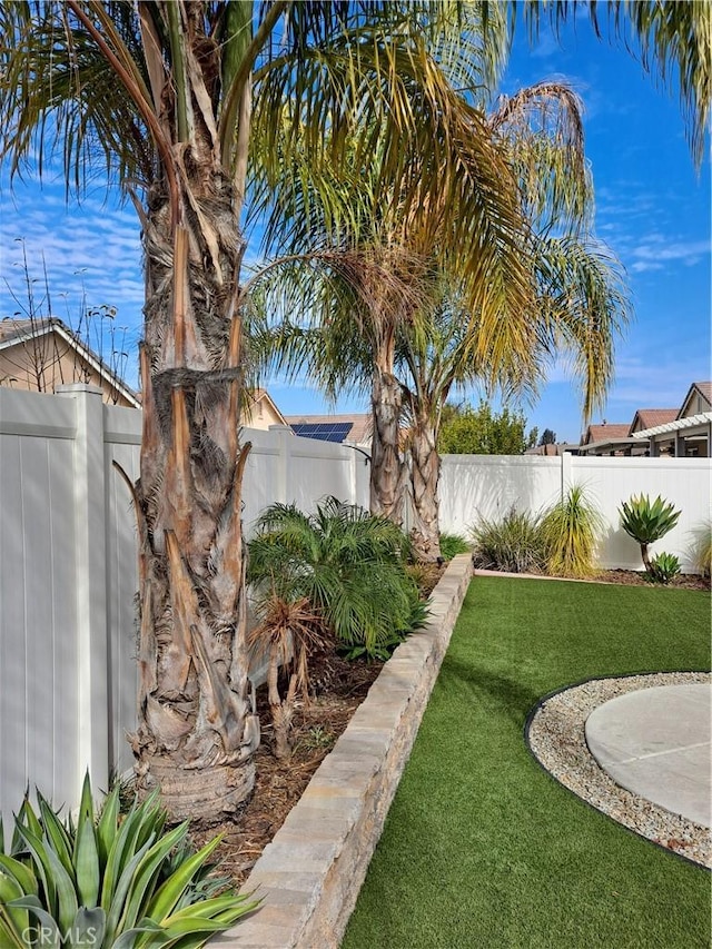 view of yard with a fenced backyard