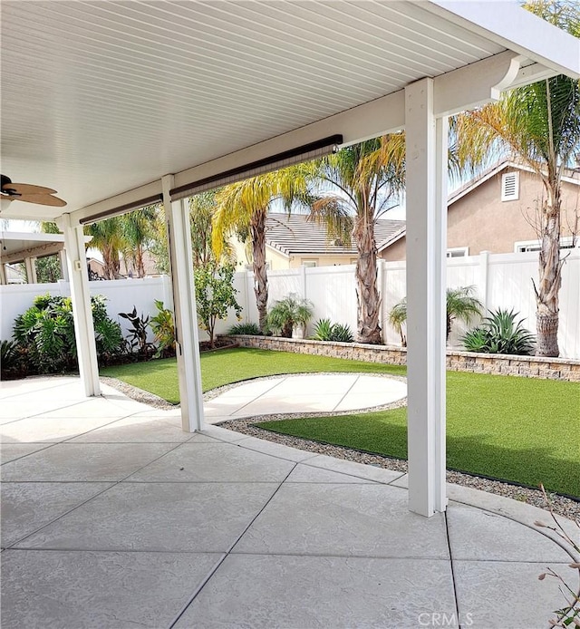 view of patio / terrace with a fenced backyard and ceiling fan