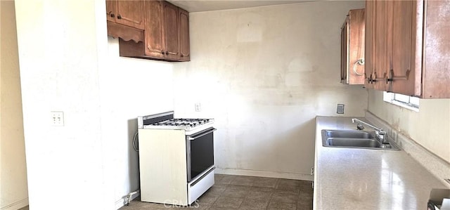 kitchen featuring sink and gas range gas stove