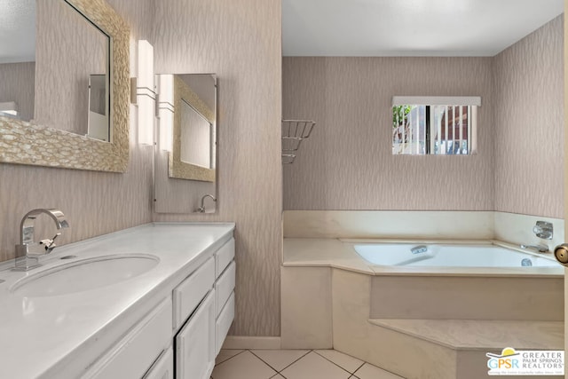 bathroom featuring vanity, tile patterned floors, and a bathtub