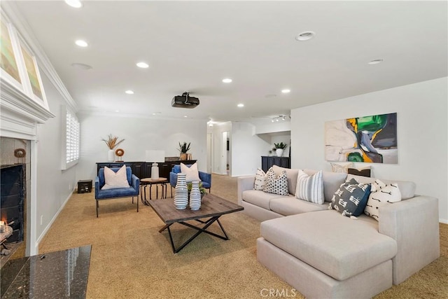 carpeted living room with a high end fireplace and ornamental molding