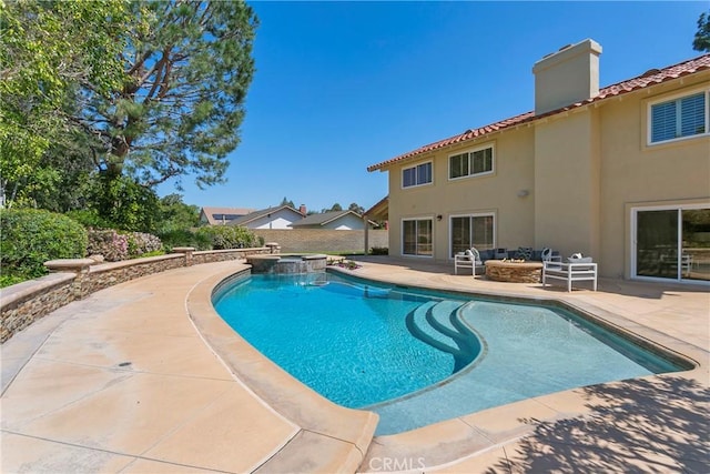 view of pool featuring an in ground hot tub and a patio