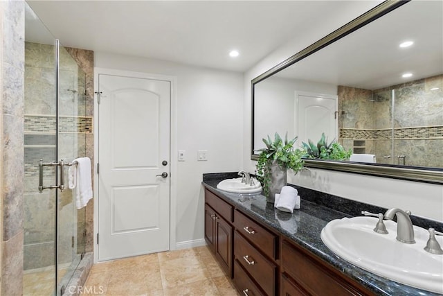 bathroom featuring tile patterned floors, vanity, and an enclosed shower