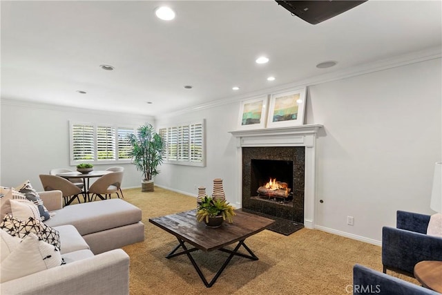 carpeted living room with ornamental molding