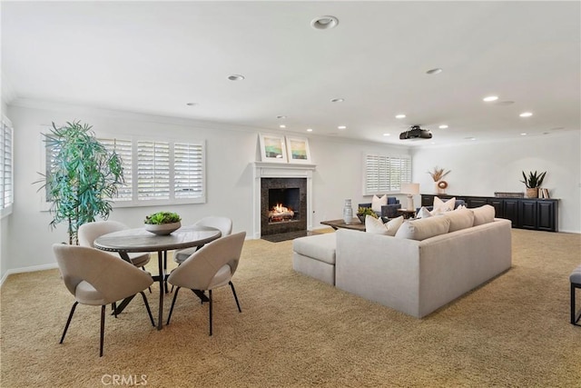 living room featuring light colored carpet and ornamental molding