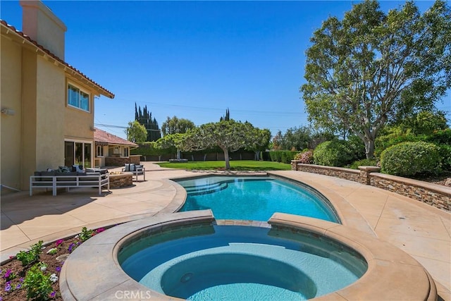 view of pool with a patio area, an outdoor hangout area, and an in ground hot tub