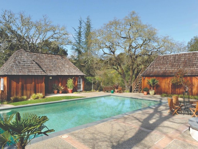 view of swimming pool with a patio area