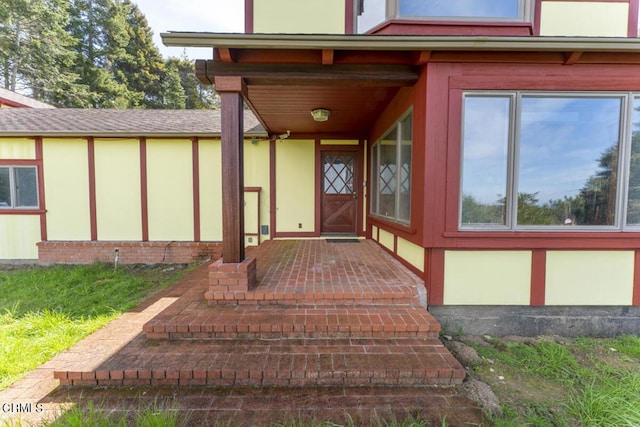 doorway to property with stucco siding