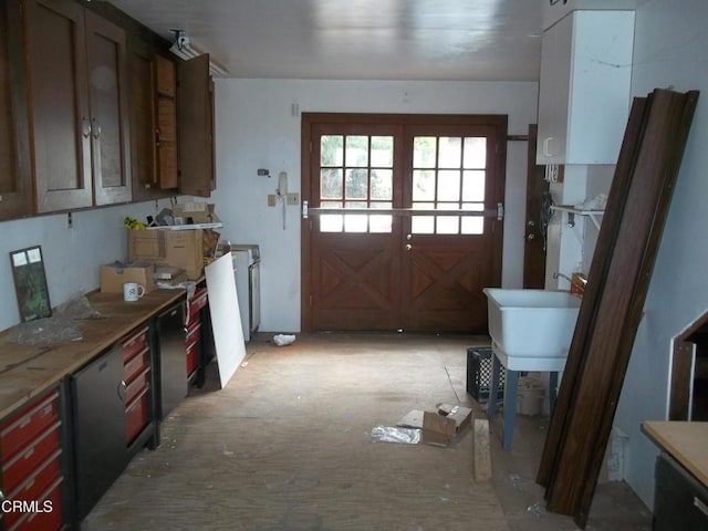 kitchen featuring light countertops and a sink