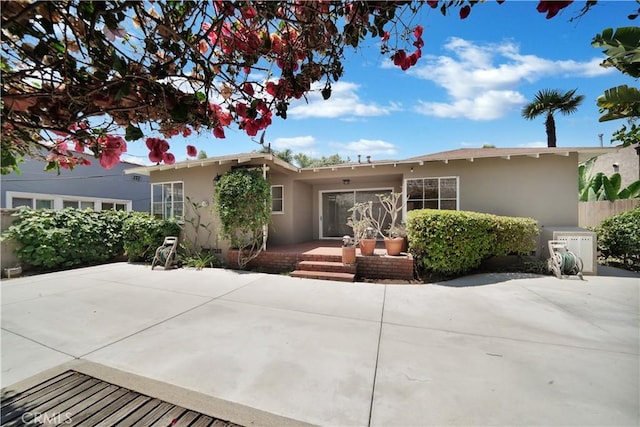 single story home featuring a patio