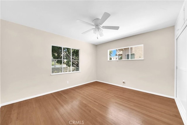 unfurnished room with wood-type flooring and ceiling fan