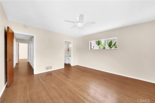 unfurnished room with wood-type flooring and ceiling fan