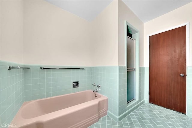 bathroom featuring a bathing tub and tile patterned floors