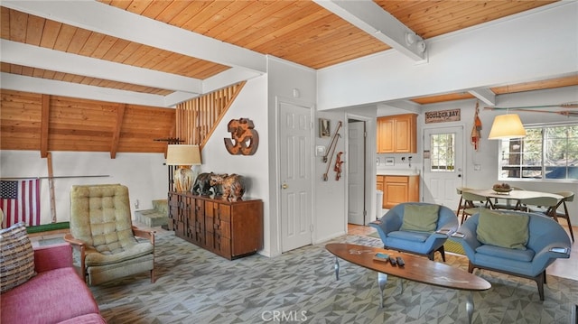 living room with beamed ceiling and wooden ceiling