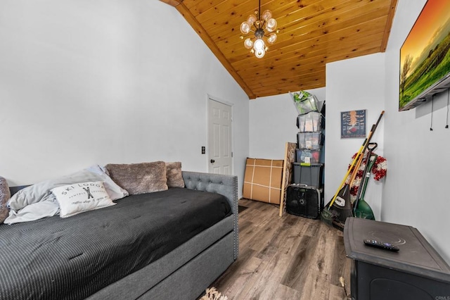 bedroom with a chandelier, vaulted ceiling, wood-type flooring, and wooden ceiling